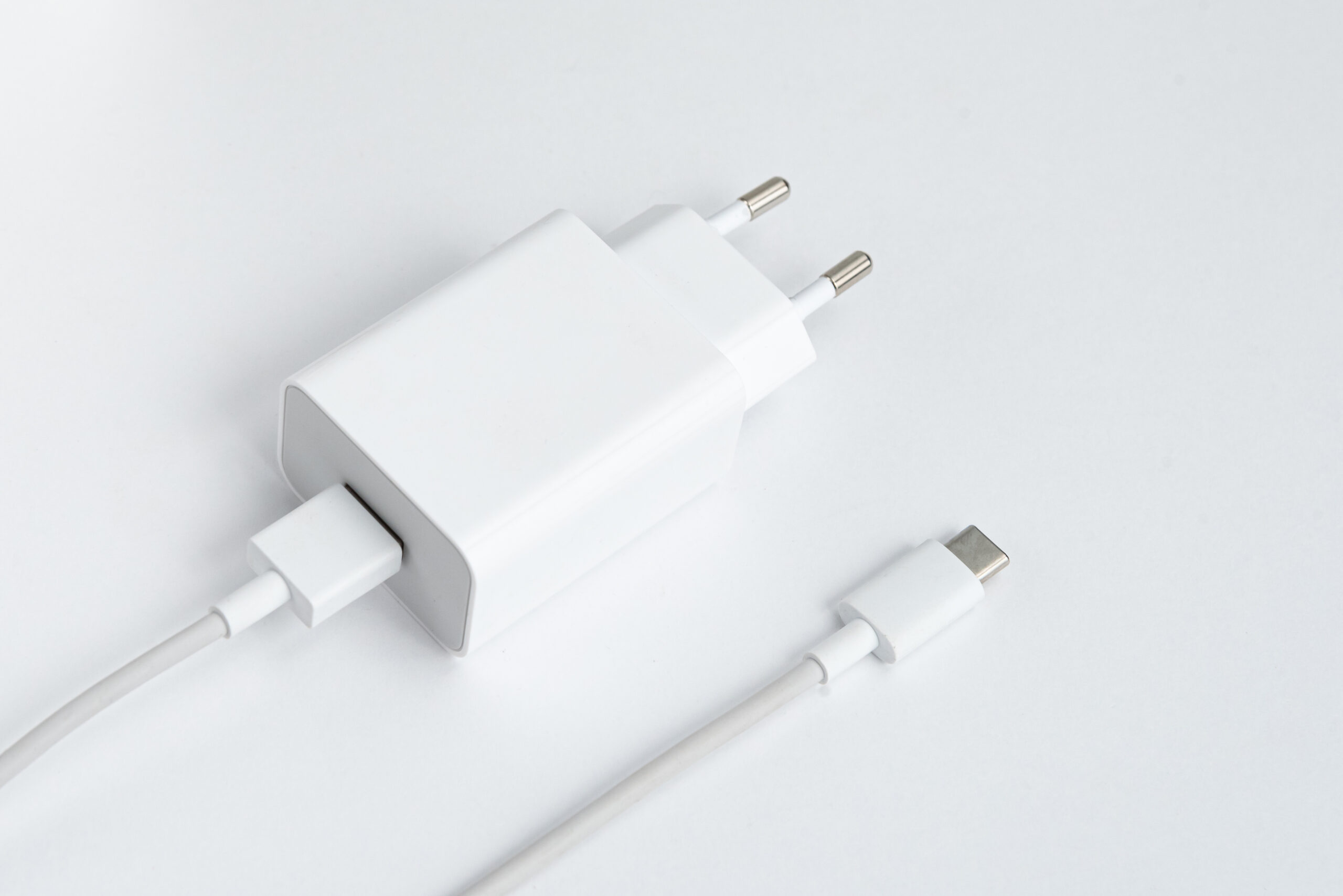 charger and usb cable type c over white isolated background