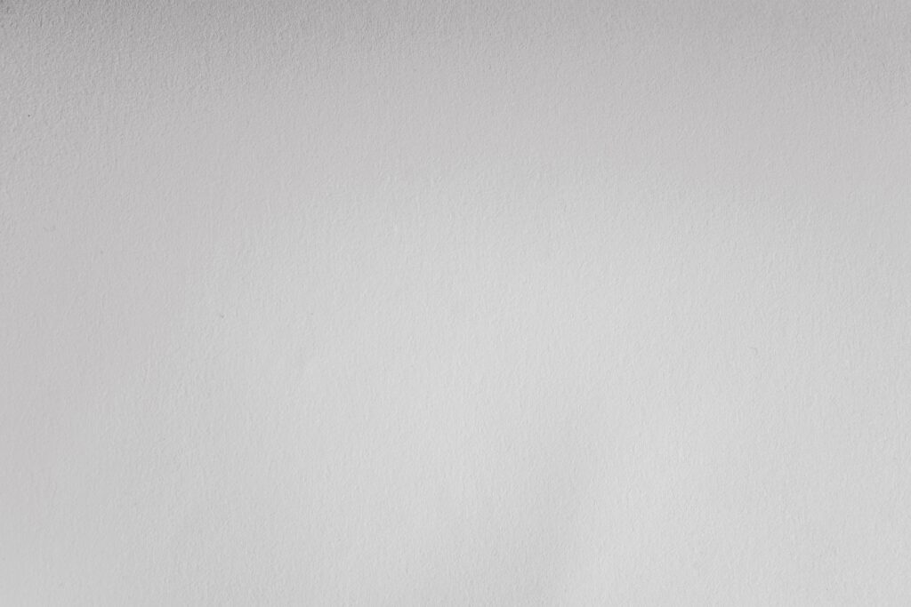 Subtle white textured surface perfect for minimalist background or design.